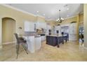 Spacious kitchen features granite countertops, stainless steel appliances, and a large center island at 12663 Hawkstone Dr, Windermere, FL 34786