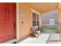 Inviting front porch with rocking chairs, ideal for relaxing and enjoying the neighborhood ambiance at 13768 Bluebird Pond Rd, Windermere, FL 34786
