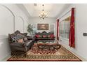 Spacious living room with recessed lighting, large windows, and exquisite furnishings at 13768 Bluebird Pond Rd, Windermere, FL 34786