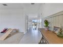 Bright hallway with decorative wood accents leads into a dining area with scenic views at 1854 Juneberry St, Clermont, FL 34715