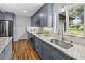 Bright kitchen featuring stainless steel appliances, granite countertops, and updated cabinetry at 2244 Brookshire Ave, Winter Park, FL 32792