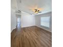 Bright living room boasts wood flooring, neutral paint, and plenty of natural light at 2524 Daffadil Ter, Sanford, FL 32771