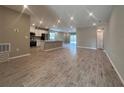 Spacious open-concept living room featuring tile floors and recessed lighting throughout at 3950 Alba Dr, Indian Lake Estates, FL 33855