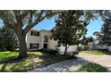 Well-maintained two-story home with a manicured front lawn and inviting curb appeal at 546 Windsor Pl, Davenport, FL 33896
