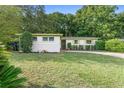 Charming single-story home with a well-manicured lawn and established landscaping at 5815 Holmes Dr, Orlando, FL 32808