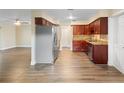 Spacious kitchen featuring updated cabinets, granite countertops, and stainless steel appliances at 5815 Holmes Dr, Orlando, FL 32808