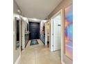Hallway with a mosaic vanity, decorative mirror, and a 'Private' bathroom at 6336 Buford St # 207, Orlando, FL 32835