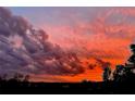 Vibrant sky with fiery pink and orange hues, creating a breathtaking colorful scene at 6336 Buford St # 207, Orlando, FL 32835