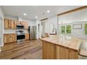 Beautiful kitchen with stainless steel appliances, light wood cabinets, and butcher block island at 1235 Arapaho Trl, Geneva, FL 32732