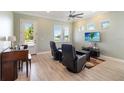 Cozy living area with comfortable seating, a ceiling fan, and great natural light at 13755 Benavente Ave, Orlando, FL 32827
