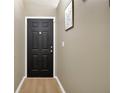 Inviting entryway featuring a modern door and neutral wall colors, creating a warm welcome at 2308 Donegan Pl, Orlando, FL 32826
