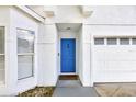 Close-up of the home's entrance featuring a striking blue door and a welcoming entrance at 2308 Donegan Pl, Orlando, FL 32826