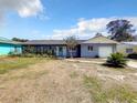 Traditional home with blue paint, a new roof, and a well-manicured lawn at 249 Spartan Dr, Maitland, FL 32751