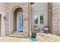 Charming front entrance with stone accents and outdoor seating at 25537 High Hampton Cir, Sorrento, FL 32776