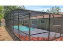 Fully screened-in swimming pool enhances the outdoor living space in the backyard at 2804 Clearfield Ave, Orlando, FL 32808