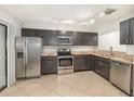 Well-equipped kitchen features stainless steel appliances, granite countertops, and tile flooring at 546 Northbridge Dr, Altamonte Springs, FL 32714