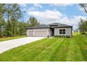 Lovely single-story home with a well-manicured lawn and a spacious driveway at 6929 Sw 130Th Lane Rd, Ocala, FL 34473