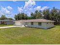 Inviting home with well-kept front yard, featuring an attached two-car garage at 7360 Canal Dr, Sanford, FL 32771