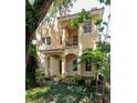 Inviting entrance with arched porch, stucco columns, and a rich wood door at 820 Ellwood Ave # A, Orlando, FL 32804