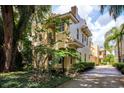 Charming two-story home with stucco exterior, a balcony, and a well-manicured, mature landscape at 820 Ellwood Ave # A, Orlando, FL 32804