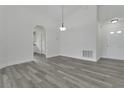 Open concept living room showcasing the new floors and neutral walls at 1406 Sean Ct, St Cloud, FL 34772