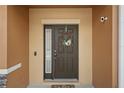 Close up of front door with stylish wreath on a well-maintained home at 1575 Downy Birch Ln, Longwood, FL 32750