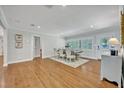 Bright dining room features hardwood floors, large windows with shutters, and neutral walls at 2112 Fosgate Dr, Winter Park, FL 32789