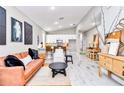 Bright living room with modern furnishings, an open floor plan, and inviting decor at 23430 Sw Neptune Blvd, Dunnellon, FL 34431