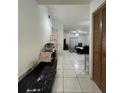 Inviting entryway featuring tile flooring leading into a living area at 2765 Montego Bay Blvd, Kissimmee, FL 34746