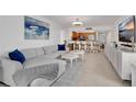 Cozy living room next to open kitchen area, perfect for Gathering gatherings and entertaining at 2947 S Atlantic Ave # 601, Daytona Beach, FL 32118