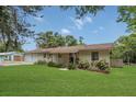 Charming home featuring an attached two-car garage and a well-maintained, lush green lawn at 2990 E Central Ave, Bartow, FL 33830