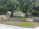 Stonebridge Place community entrance sign surrounded by lush landscaping at 6100 Stevenson Dr # 207, Orlando, FL 32835