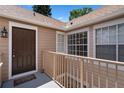 Charming second-story entryway featuring a dark wood door and 'Welcome' mat at 685 Youngstown Pkwy # 300, Altamonte Springs, FL 32714
