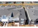 An aerial view highlighting the home's roof, landscaping, and screened-in pools in the backyards at 1070 Splash Shot Pl, Davenport, FL 33896