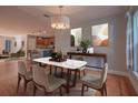 Spacious dining area with hardwood floors, open to the kitchen, perfect for entertaining guests at 2100 Forest Cir, Orlando, FL 32803
