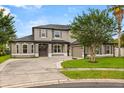 This is a charming two-story home featuring a well-maintained lawn and a classic architectural design at 218 Pebblerock Ct, Orlando, FL 32828