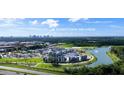 Aerial view of community near Downtown Orlando, showing pool, landscaping and lake at 2233 Valentine Aly, Orlando, FL 32804