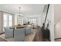 Bright living room showcasing dining area, hardwood floors, and modern furnishings at 2233 Valentine Aly, Orlando, FL 32804