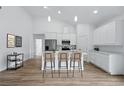 Modern kitchen with stainless steel appliances and a large island with seating at 436 Caraway Dr, Kissimmee, FL 34759