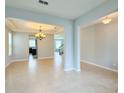 Inviting living room with tile floors, chandelier, and an open floor plan at 5107 Longmeadow Park St, Orlando, FL 32811