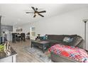 Open concept living room and dining area with neutral colors and plenty of natural light at 555 Jett Ln, Davenport, FL 33837