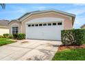 This home features a convenient two car garage with an automatic door at 8152 Fan Palm Way, Kissimmee, FL 34747