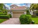 Charming single-Gathering home with well-maintained landscaping and a two-car garage at 8108 Via Bella Notte, Orlando, FL 32836
