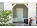 Charming front entrance with stylish door and landscaped surroundings at 1292 Blue Island Dr, Clermont, FL 34714