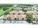 Sprawling condo community with lush green spaces and a tranquil pond at 13207 Villa Vista Dr # 205, Orlando, FL 32824