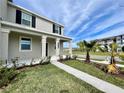 Inviting home exterior with manicured lawn and fresh landscaping at 15579 Water Spring Blvd, Winter Garden, FL 34787