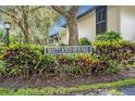 Maitland House sign surrounded by colorful bushes at 210 Magnolia Rd # 214, Maitland, FL 32751