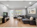 Spacious living room with modern decor, hardwood floors, and large windows, offering a comfortable living space at 2918 Rodrick Cir, Orlando, FL 32824