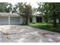 View of front of home and driveway and garage at 305 E Orange St, Altamonte Springs, FL 32701