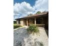 Close up of the front porch and stone garden of this well-maintained home at 34008 S Haines Creek Rd, Leesburg, FL 34788